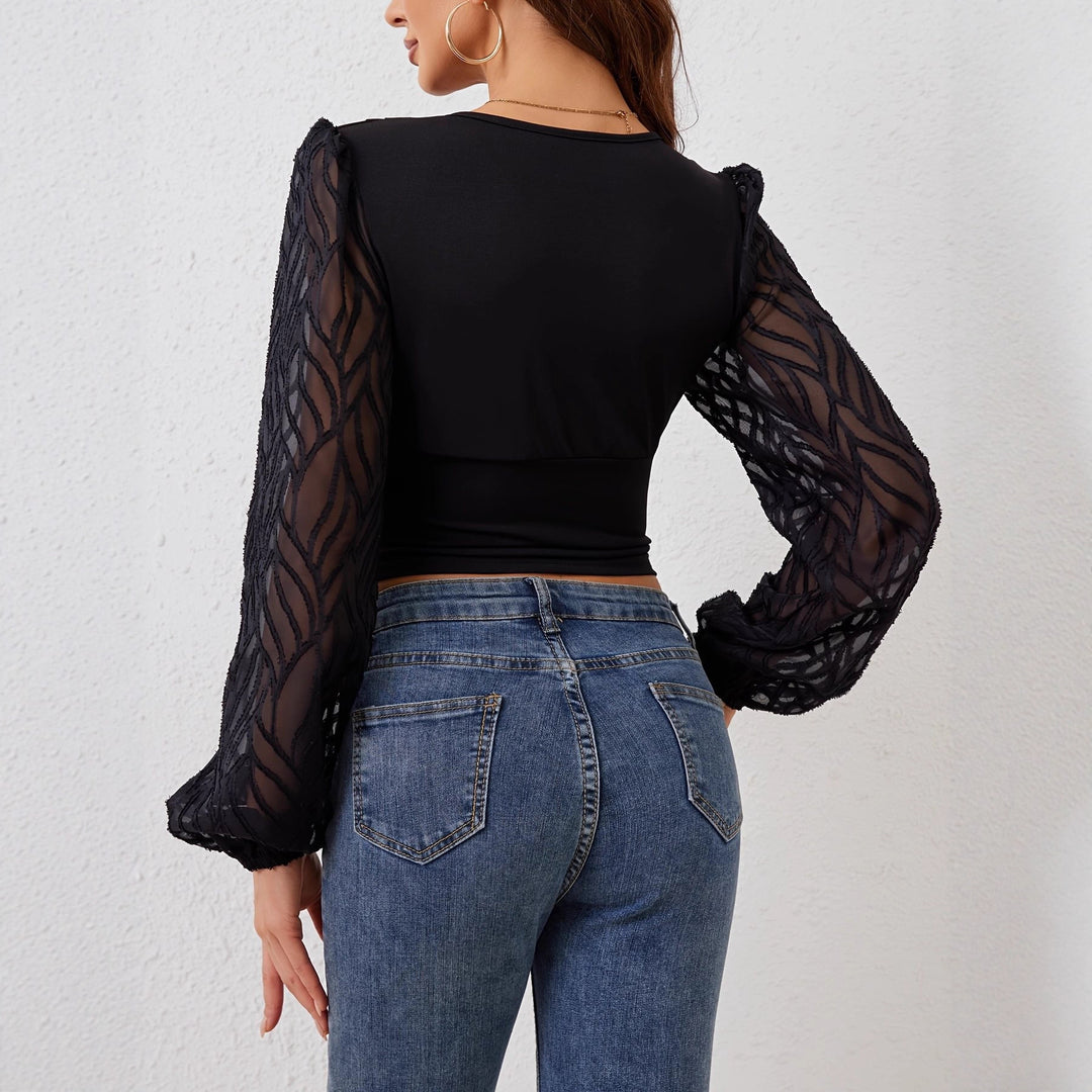 Shirt for women with elegant transparent sleeves and chic button-embellished details