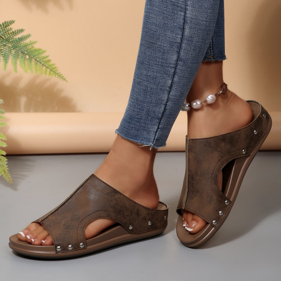 Comfortable slip-on sandals for ladies with a trendy cut-out design and an elegant rhinestone pattern Lune London