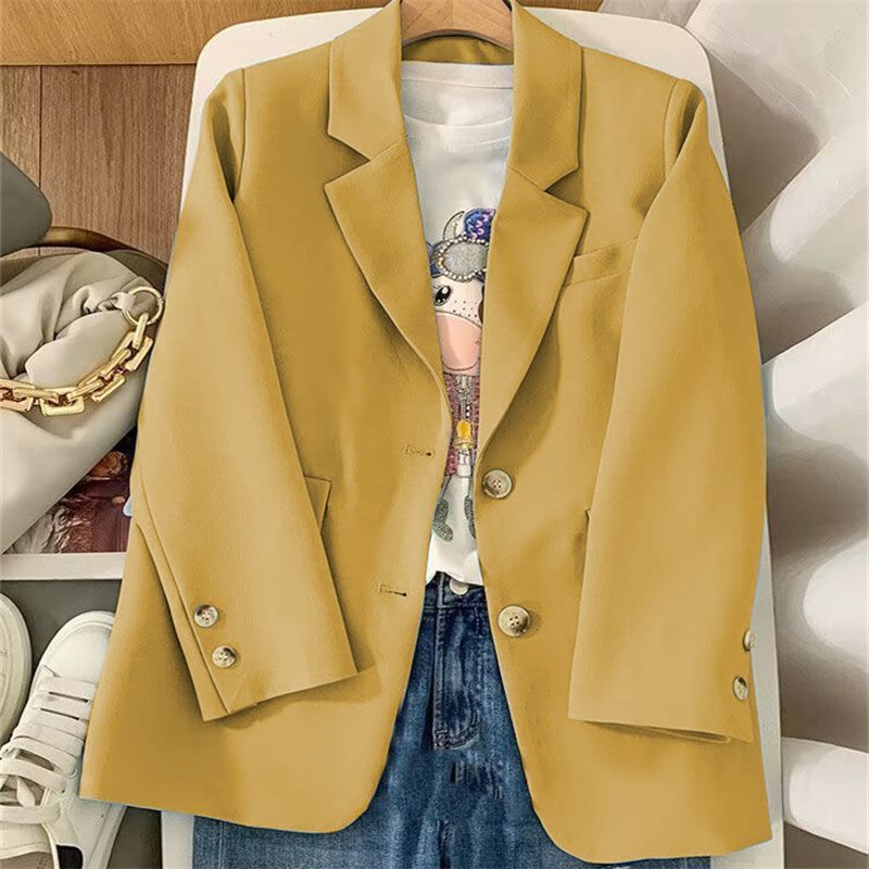 Blazer féminin chic avec tissu texturé et détails de bouton élégants Chic & Stil