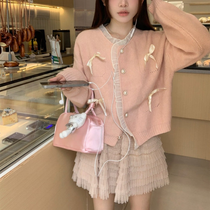 Knitted ladies' jacket with playful knots and pearl buttons Lune London