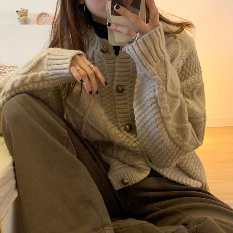 Thick knitted cardigan for women with button details and cable knit pattern Lune London