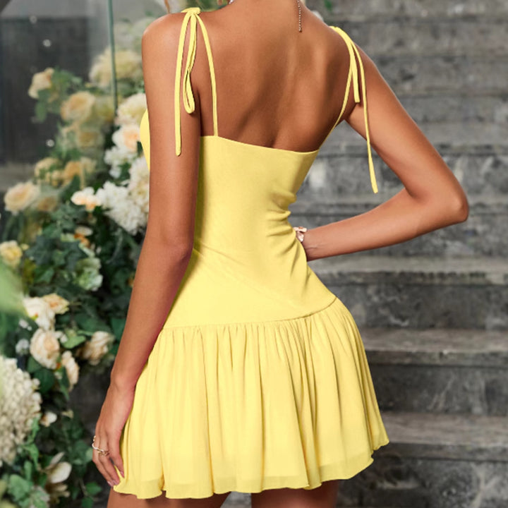 Summer ruffled dress for women with spaghetti straps and a flowy hem Lune London