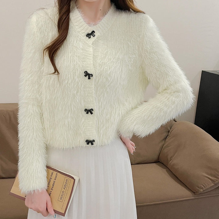 Women's cozy wool pullover with decorative bow buttons Lune London