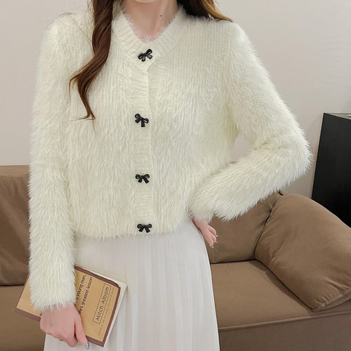 Women's cozy wool pullover with decorative bow buttons Lune London