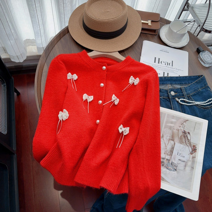 Knit jacket for women with feminine appliques and chic button details