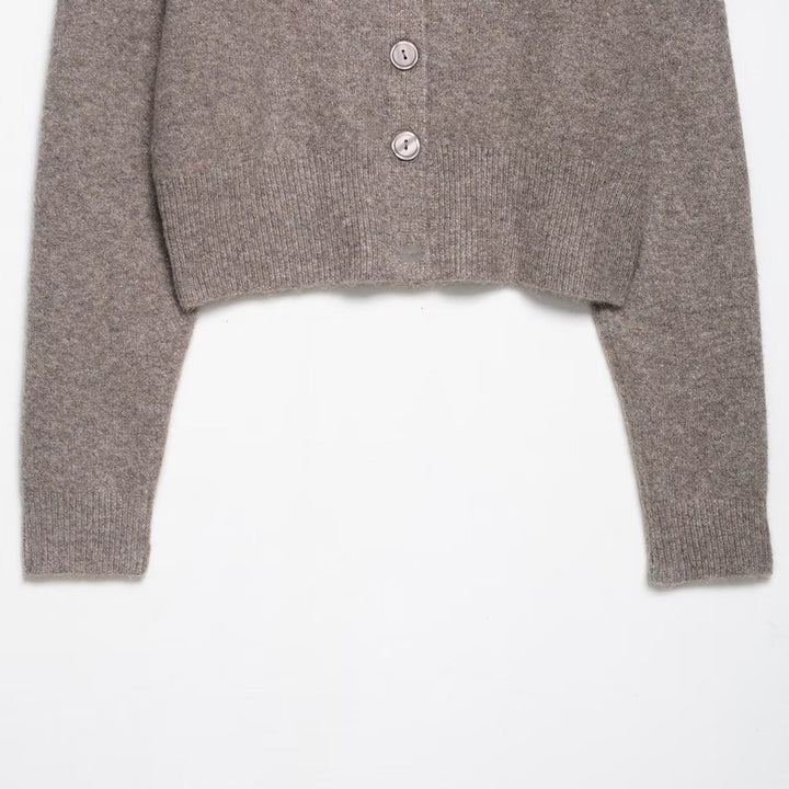 Short knitted jacket for women with fine buttons and an elegant cut Lune London