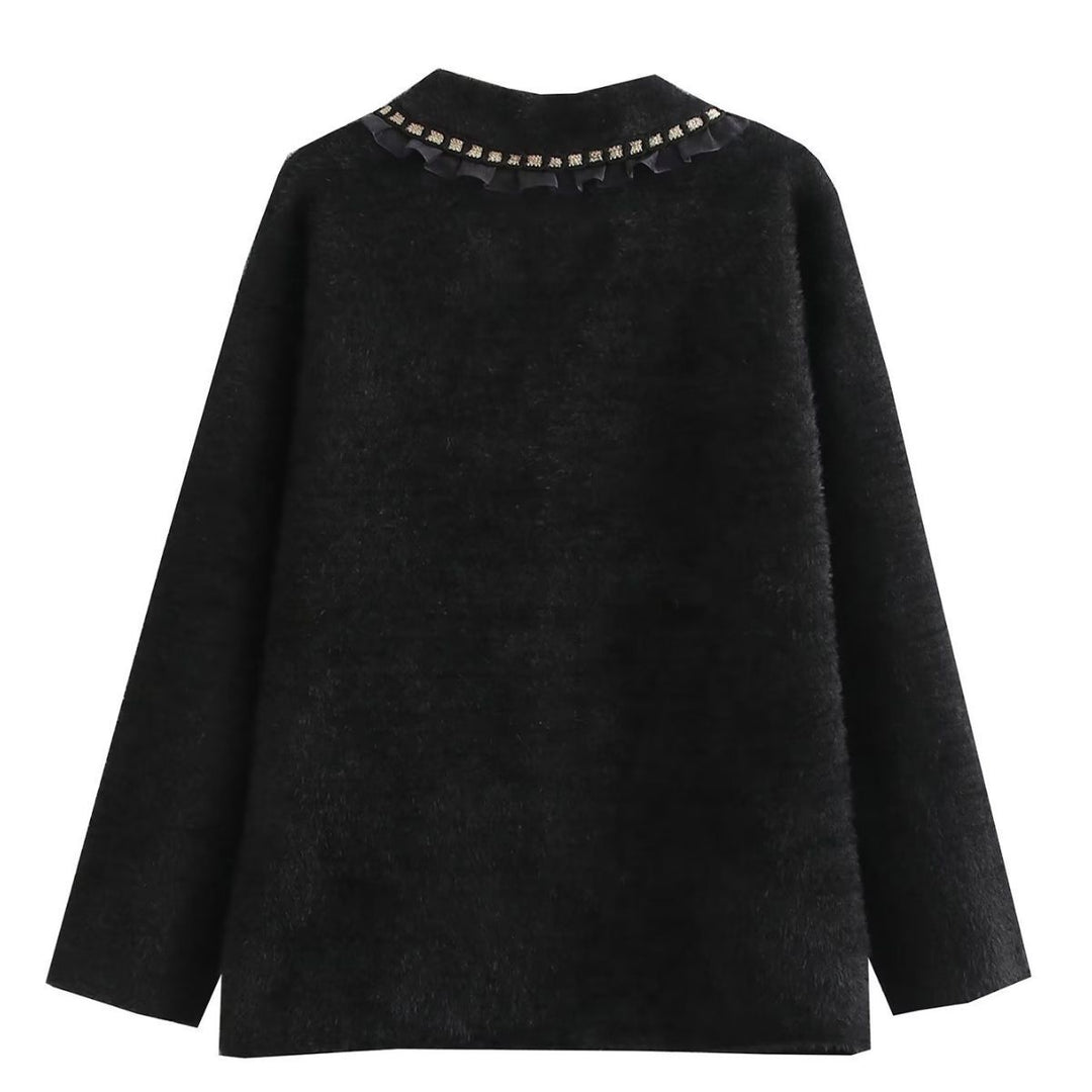 Fashionable women's knitted jacket with decorative ruffles and button details adorned with pearls Lune London