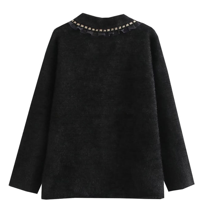 Fashionable women's knitted jacket with decorative ruffles and button details adorned with pearls Lune London