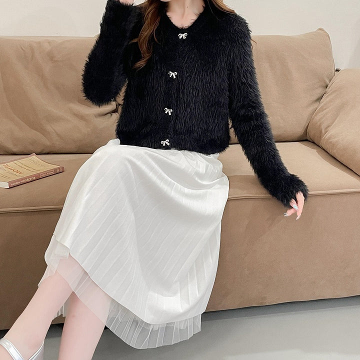 Women's cozy wool pullover with decorative bow buttons Lune London