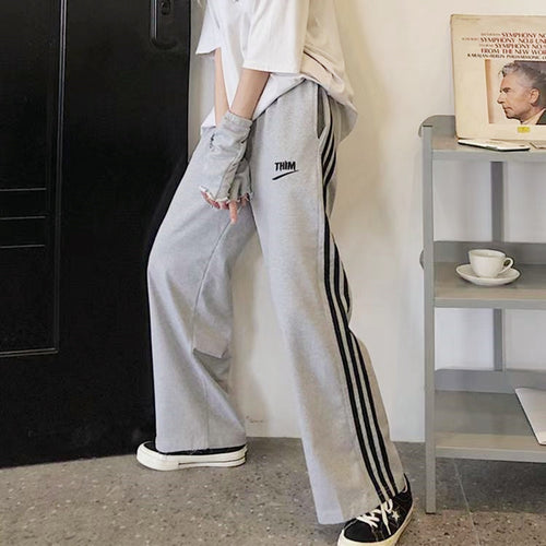 Pantalons décontractés sportifs pour femmes avec des rayures modernes Chic & Stil