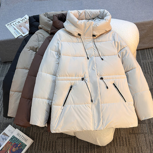 Insulated quilted jacket for women with a high collar and functional zip pockets Lune London