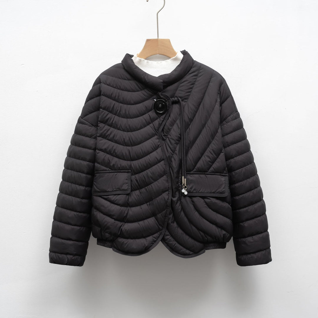 Trendy quilted jacket for women with asymmetrical cut and practical pockets Lune London