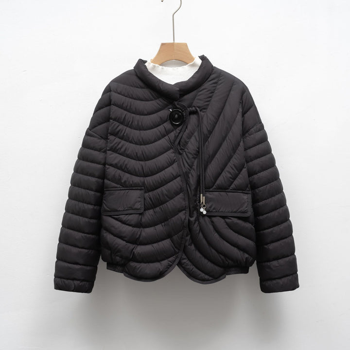 Trendy quilted jacket for women with asymmetrical cut and practical pockets Lune London