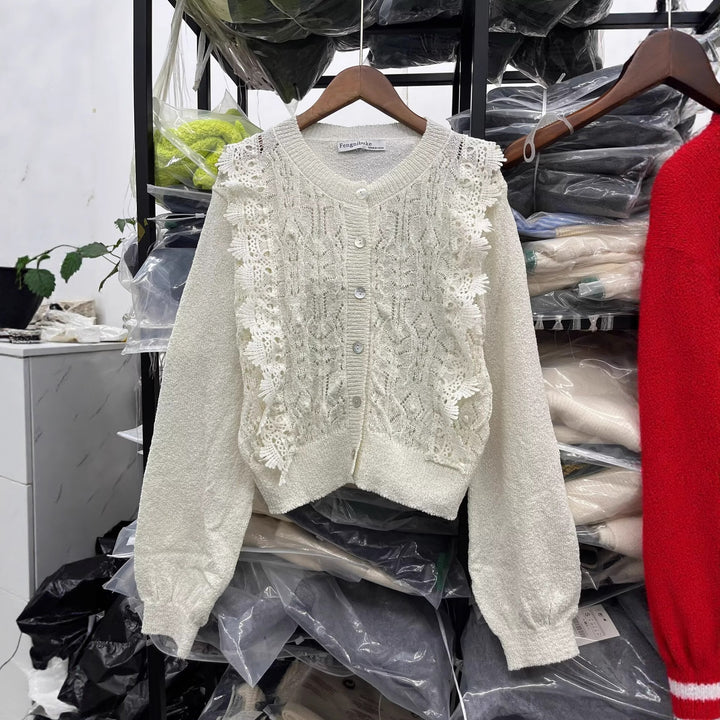 Knitted jacket for women with delicate crochet accents and a chic button placket