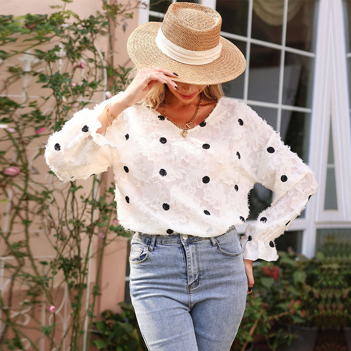 Tunique féminine à la mode avec un motif floral décoratif et des manches bouffantes Chic & Stil