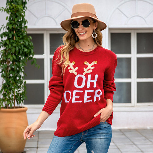 Knitted sweater for ladies with festive reindeer pattern and gold buttons Lune London