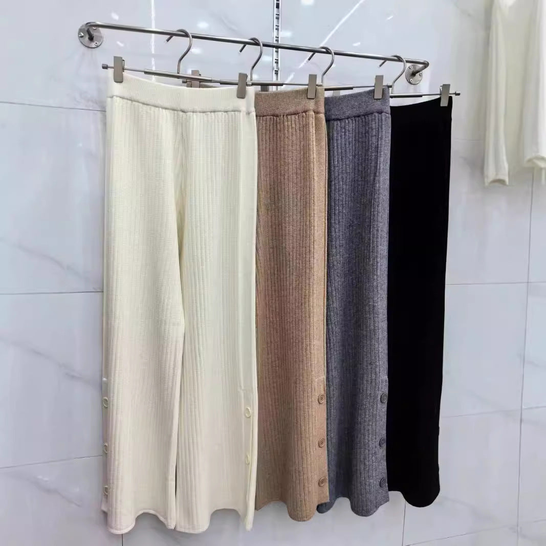 Pleated palazzo pants for women with button details Lune London