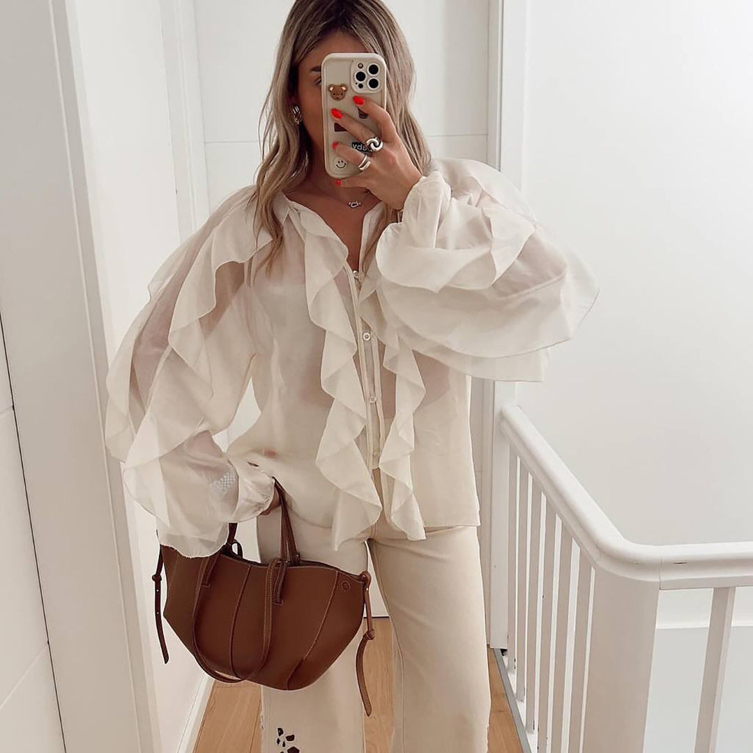 Blouse woman with voluminous ruffle details and a wavy hem Lune London