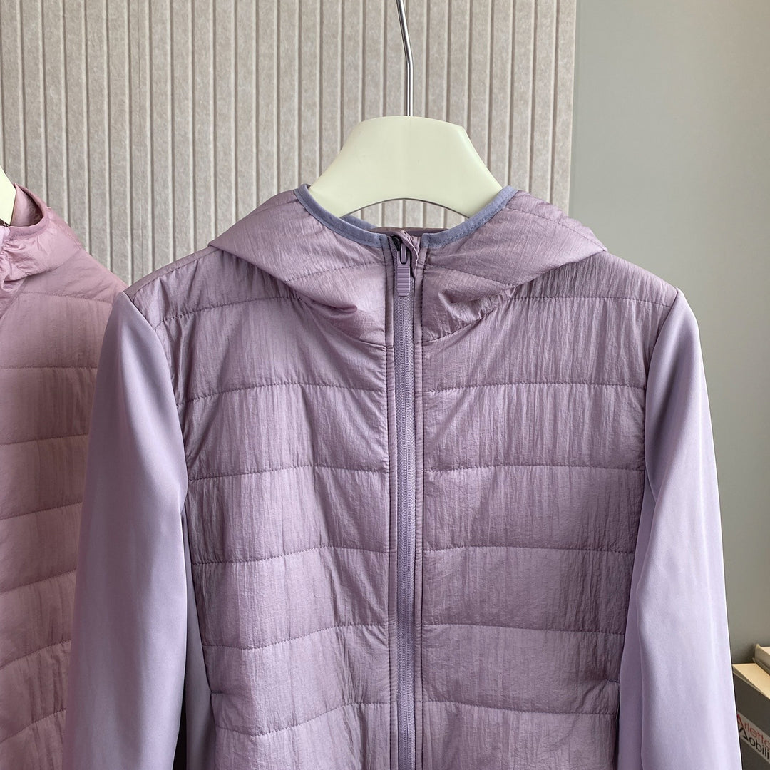 Veste hybride légère pour femmes avec capuche pratique et inserts isolants Chic & Stil