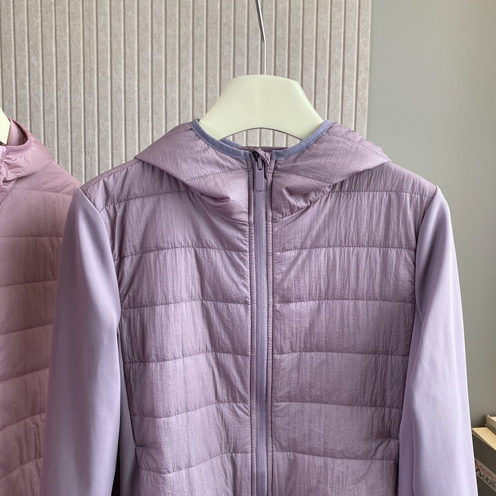 Veste hybride légère pour femmes avec capuche pratique et inserts isolants Chic & Stil