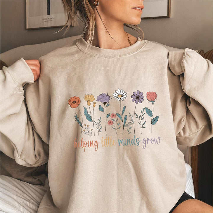 Sweat-shirt femme avec des manches volumineuses et un imprimé floral motivant Chic & Stil