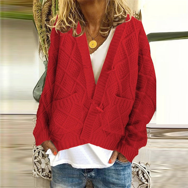 Thick knit jacket for women with a decorative cable design and practical pockets Lune London