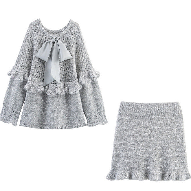 Elegant ladies knitted outfit with ruffles and bow accents Lune London