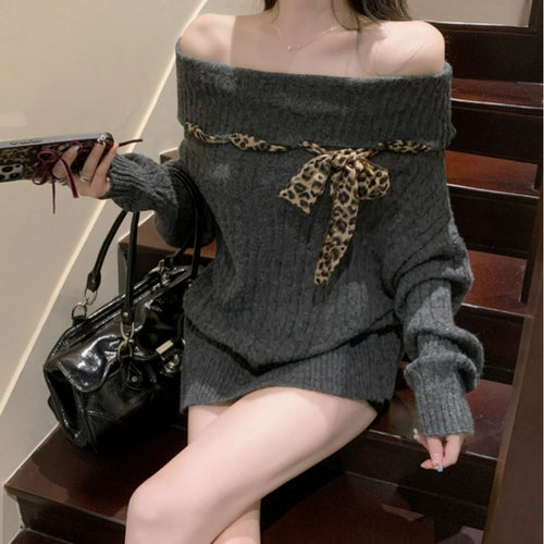 Chunky knit sweater for women with off-the-shoulder design and playful bow accent Lune London