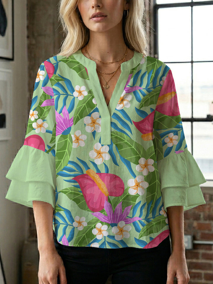 Women’s blouse with voluminous ruffled sleeves and floral pattern Lune London