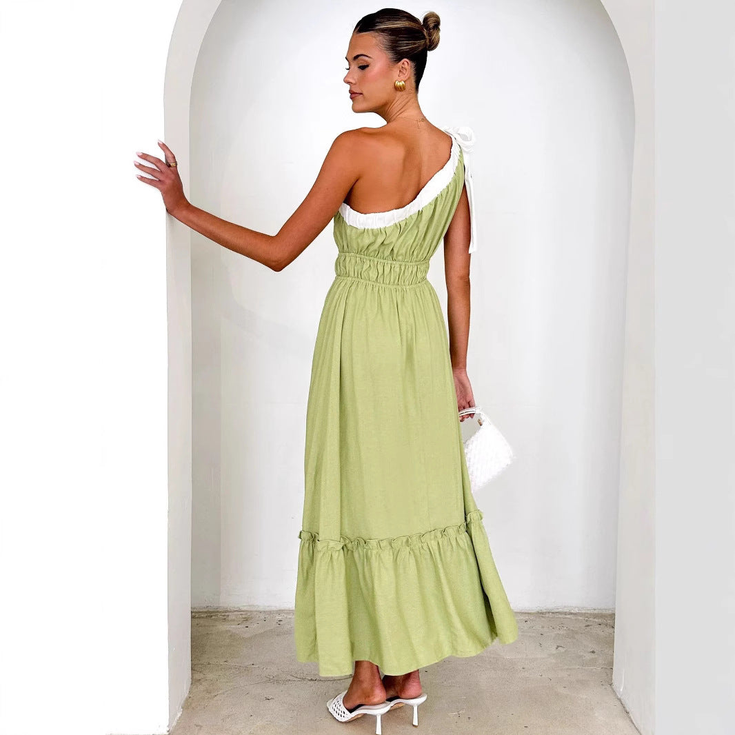 Women's maxi dress with asymmetrical shoulder design and flowing pleated skirt