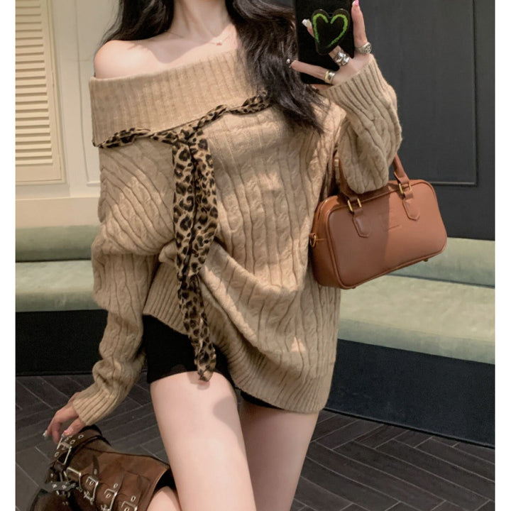 Chunky knit sweater for women with off-the-shoulder design and playful bow accent Lune London