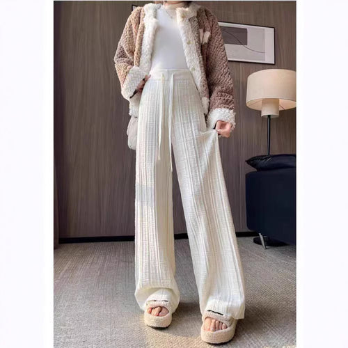 Loose linen pants for women with elastic waistband and striped design Lune London