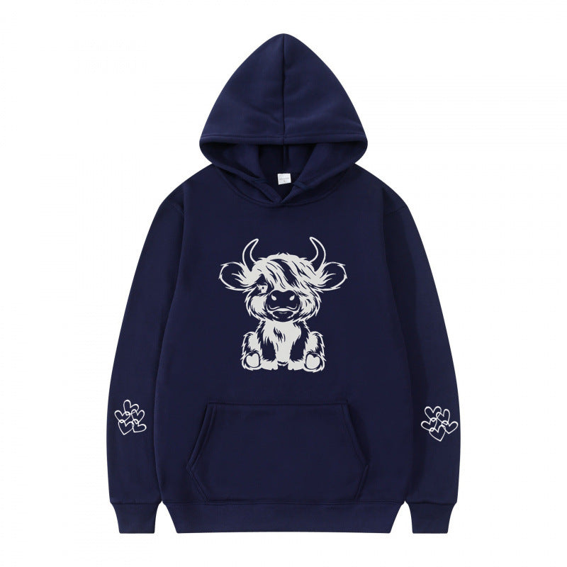 Women's hooded sweatshirt with charming cow motif and practical kangaroo pockets Lune London