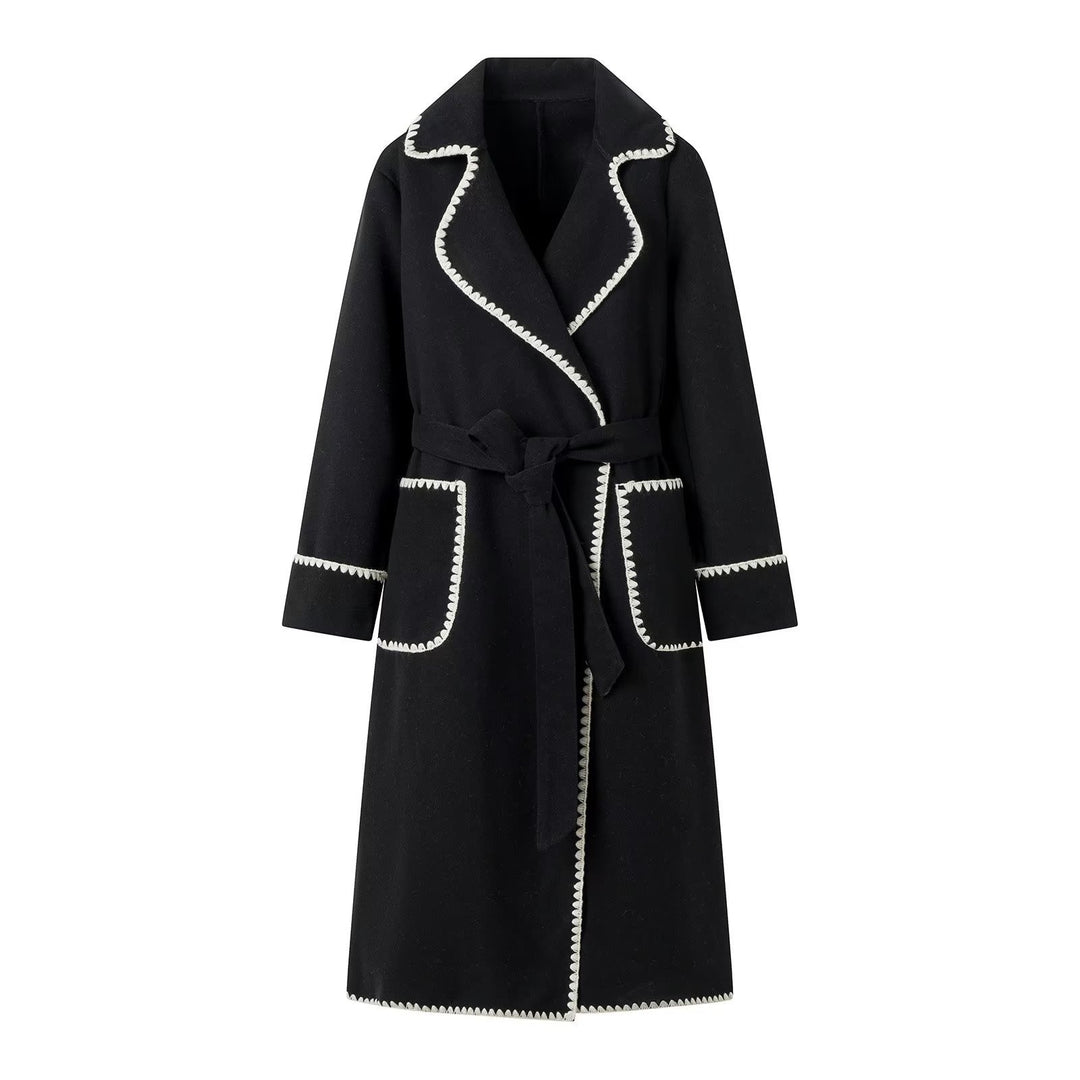 Elegant long coat for women with a tie belt and contrasting piping Lune London