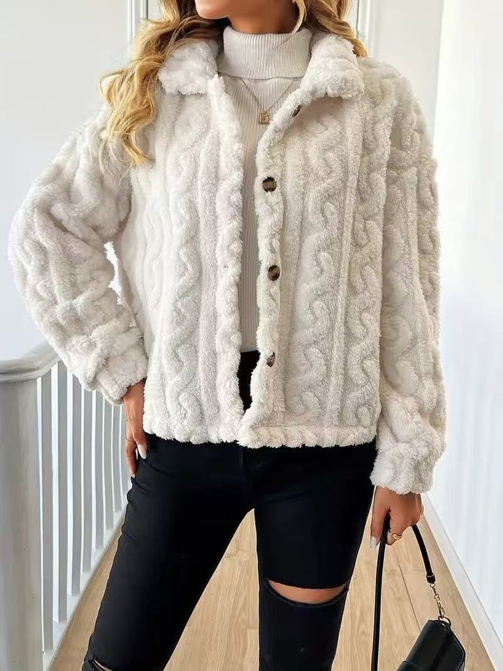 Women’s plush jacket with button closure and striped design.