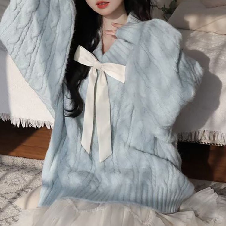 Ladies Large knitted sweater with bow detail and cable knit pattern Lune London