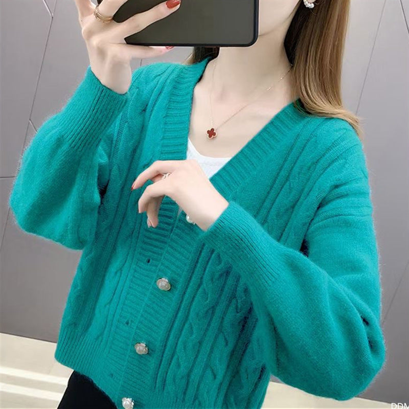 Knitted jacket for women with an elegant braid pattern and high-quality button details Lune London