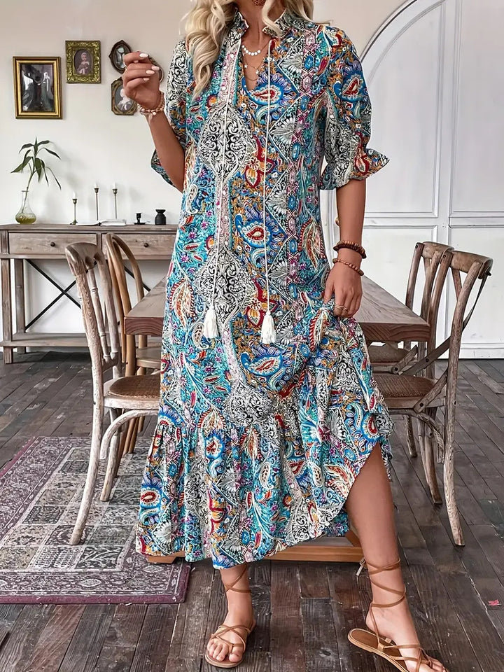 Maxi dress for women with playful paisley pattern and ruffled details Lune London