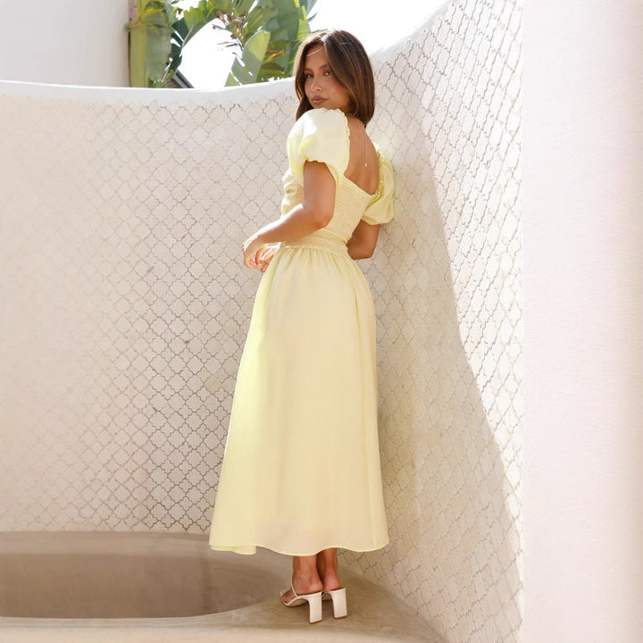 Women's maxi dress with innovative cut-out design and side pockets
