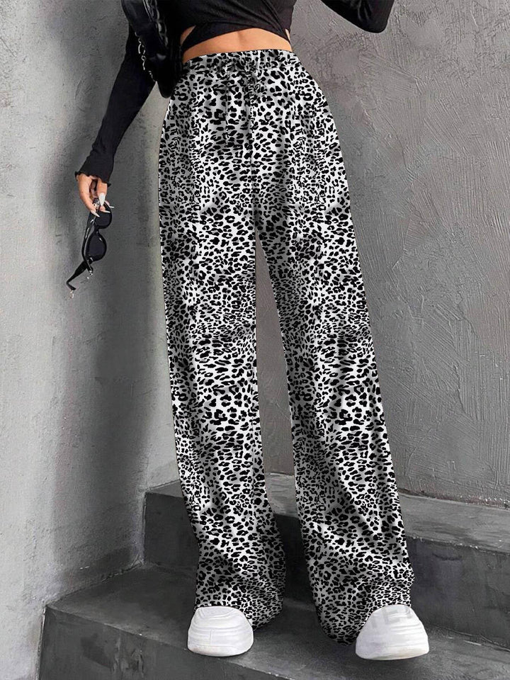 Pantalons plissés à coupe large pour femmes avec taille élastique et poches latérales pratiques Chic & Stil
