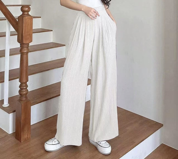 Wide pleated trousers for women with high pockets and elastic waist Lune London