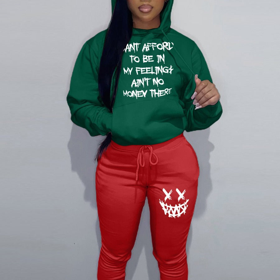Casual women’s outfit with hoodie and jogger pants, featuring unique writing and creative patterns Lune London