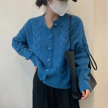 Women's chunky knit sweater with button placket and elegant cable pattern Lune London