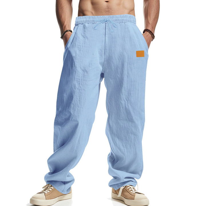 Linen pants for men with a relaxed fit featuring an adjustable drawstring and practical side pockets Lune London