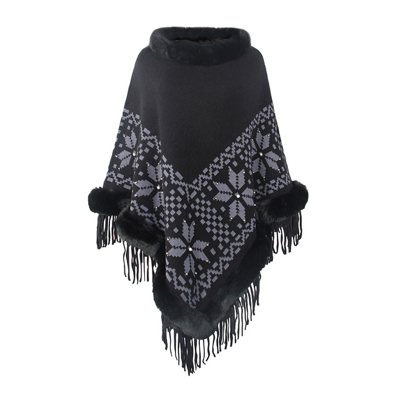 Elegant women's poncho with decorative fringe design and faux fur trim Lune London