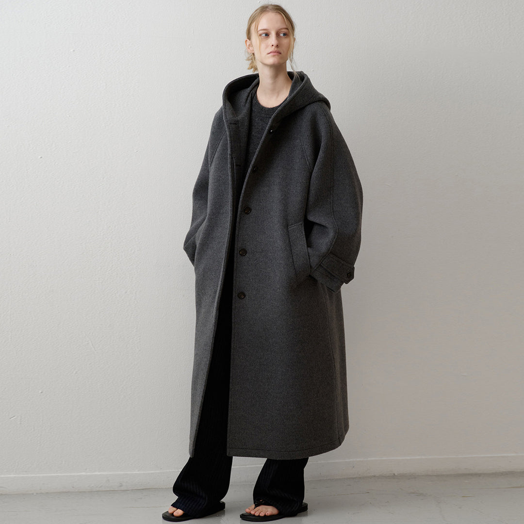 Manteau en laine surdimensionné pour femmes avec capuche et poches pratiques Chic & Stil