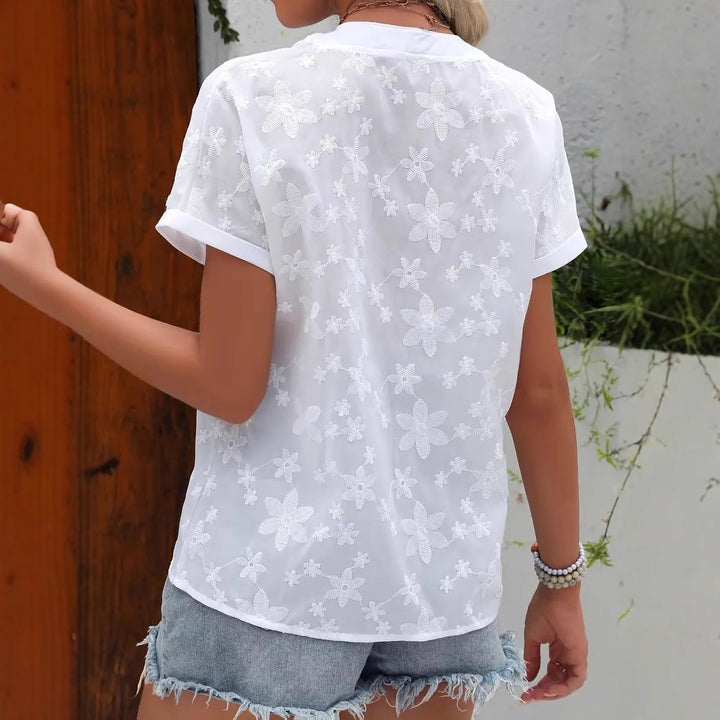 Shirt for women with an elegant embroidered floral pattern and a modern button detail Lune London