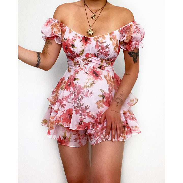 Women's short sleeve overall with romantic floral pattern and flowing cut
