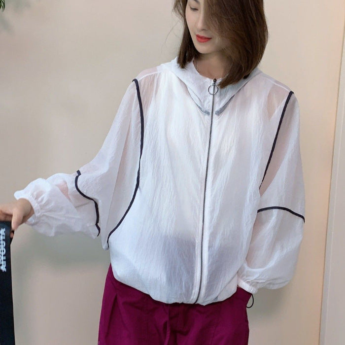 Women's lightweight hoodie jacket with elastic hem and reflective details Chic & Stil