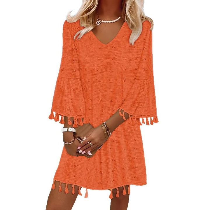 Beach dress for women with an elegant V-neckline and decorative fringes Lune London